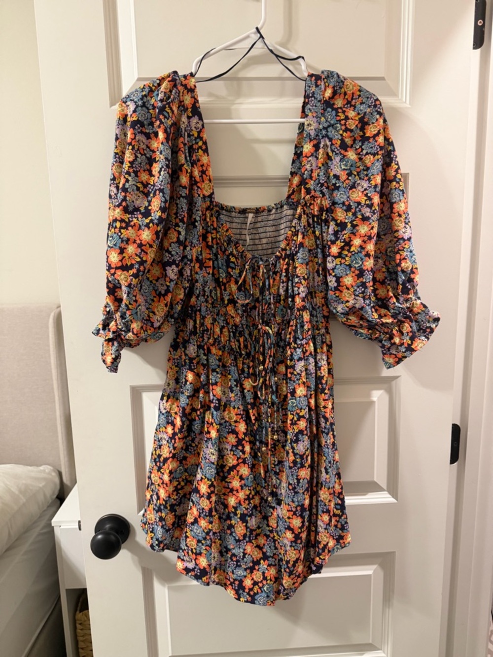 Free People Floral Smocked Romper in Navy with Orange & Blue Flowers